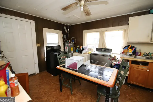 a work place with furniture and flat screen tv