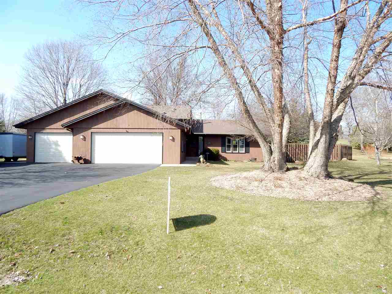 4456 Montclair Road Roscoe, IL 61073 - Photo 1 of 25 a front view of a house with a yard and garage