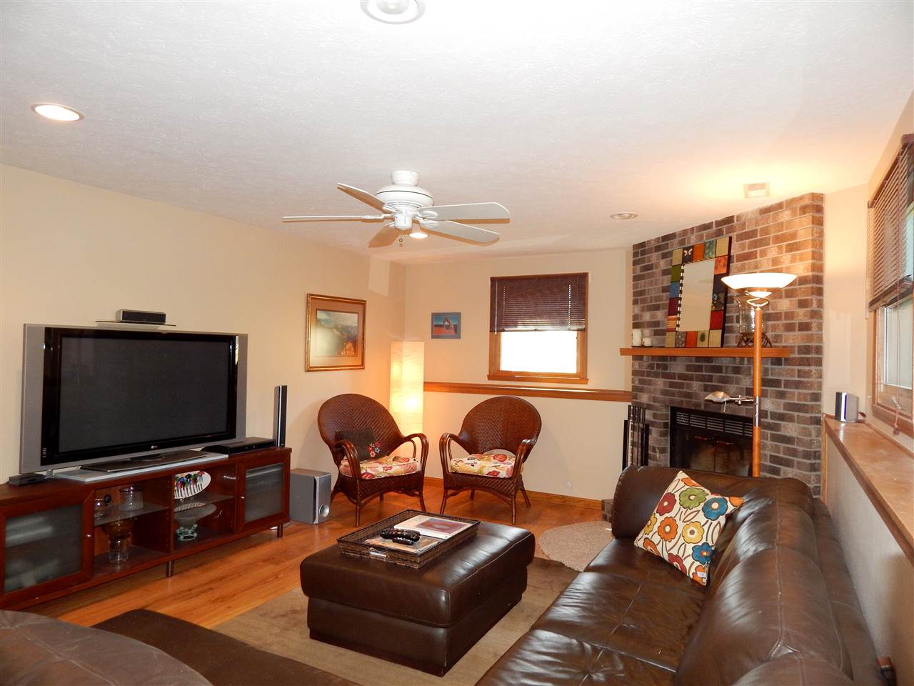 4456 Montclair Road Roscoe, IL 61073 - Photo 11 of 25 a living room with furniture and a flat screen tv