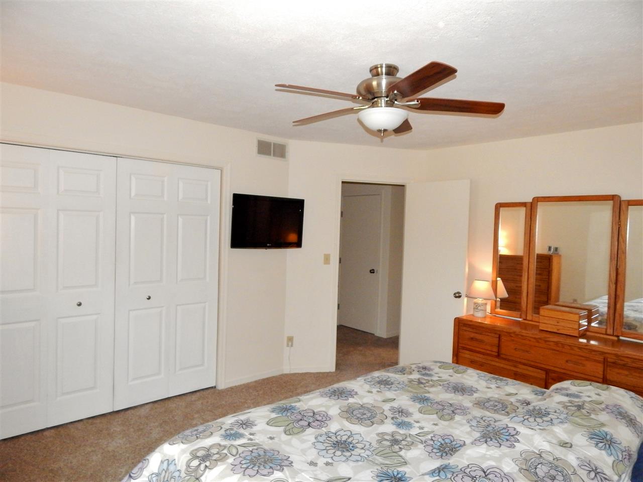 4456 Montclair Road Roscoe, IL 61073 - Photo 15 of 25 a bedroom with a bed and a television