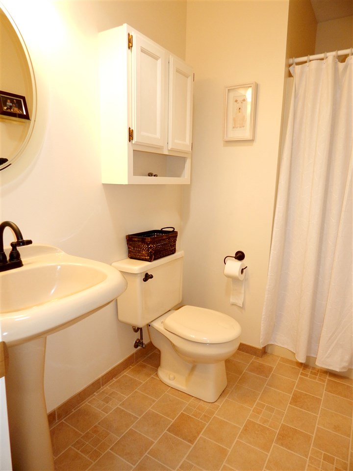 4456 Montclair Road Roscoe, IL 61073 - Photo 16 of 25 a bathroom with a sink toilet and shower