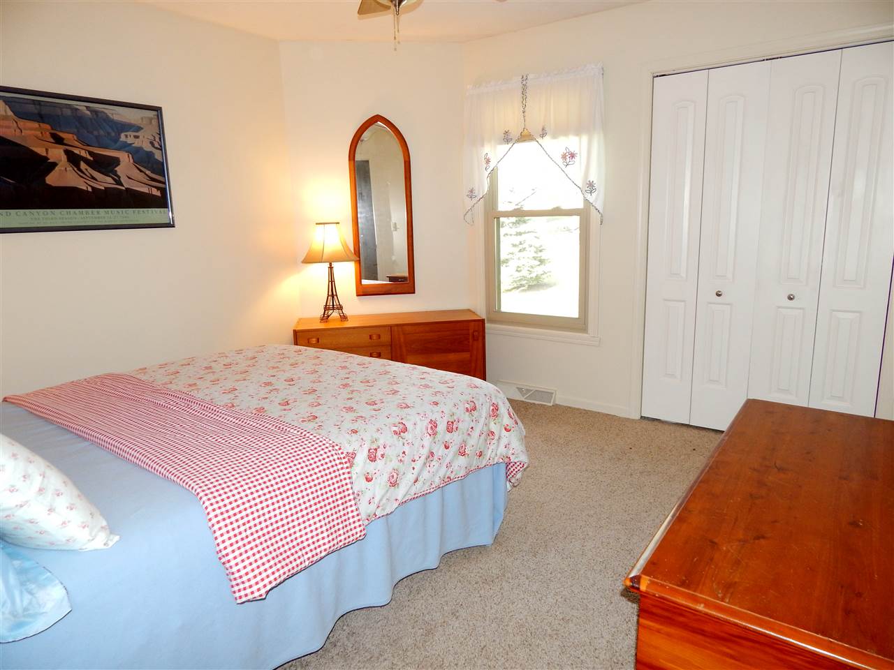 4456 Montclair Road Roscoe, IL 61073 - Photo 17 of 25 a bedroom with a bed and a painting on the wall