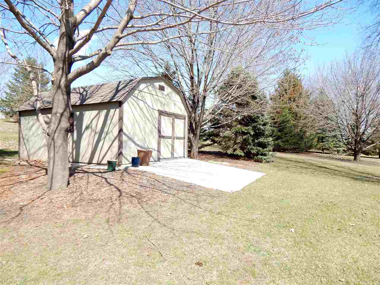 4456 Montclair Road Roscoe, IL 61073 - Photo 20 of 25 a view of large space with a trees