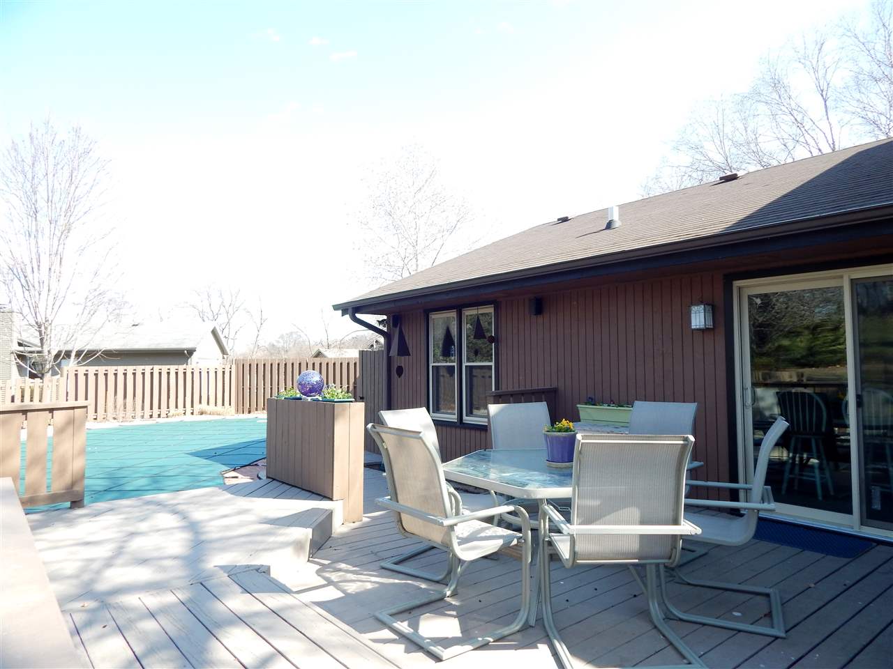 4456 Montclair Road Roscoe, IL 61073 - Photo 22 of 25 a patio with glass top table and chairs