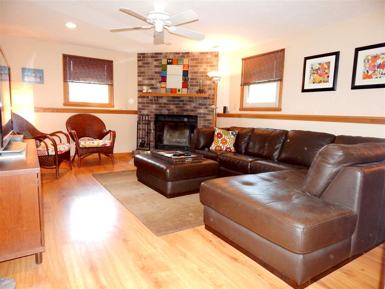 4456 Montclair Road Roscoe, IL 61073 - Photo 10 of 25 a living room with furniture and a fireplace