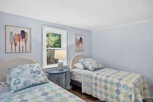 a bedroom with a bed and a lamp