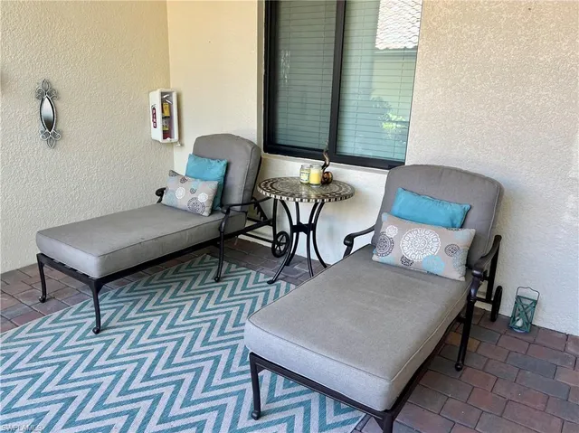 a living room with furniture and a rug