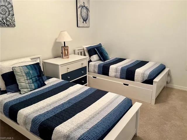 a bedroom with bed and window