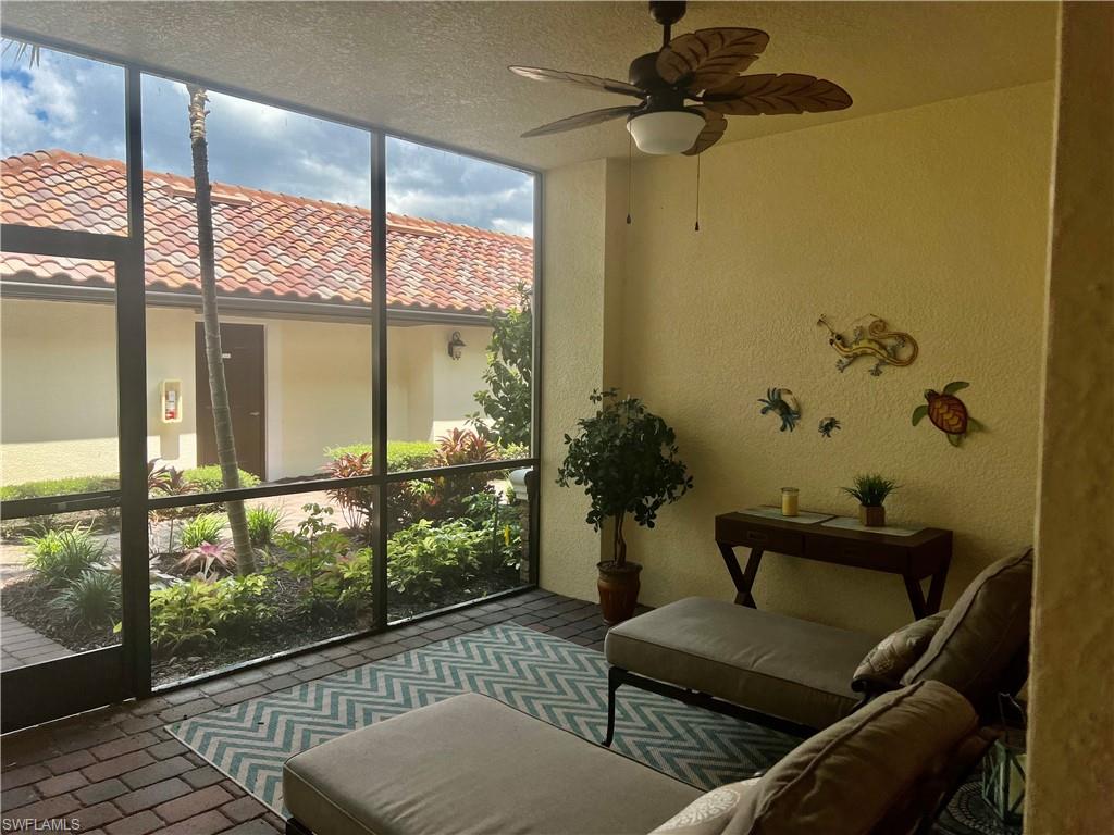 9518 Avellino Way, Unit 2313 Naples, FL 34113 - Photo 4 of 30 a living room with furniture and a potted plant