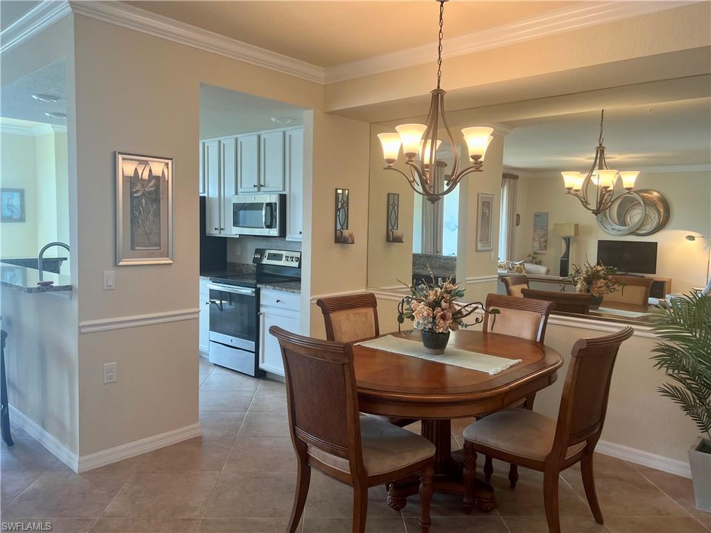 9518 Avellino Way, Unit 2313 Naples, FL 34113 - Photo 7 of 30 a dining room with furniture and window