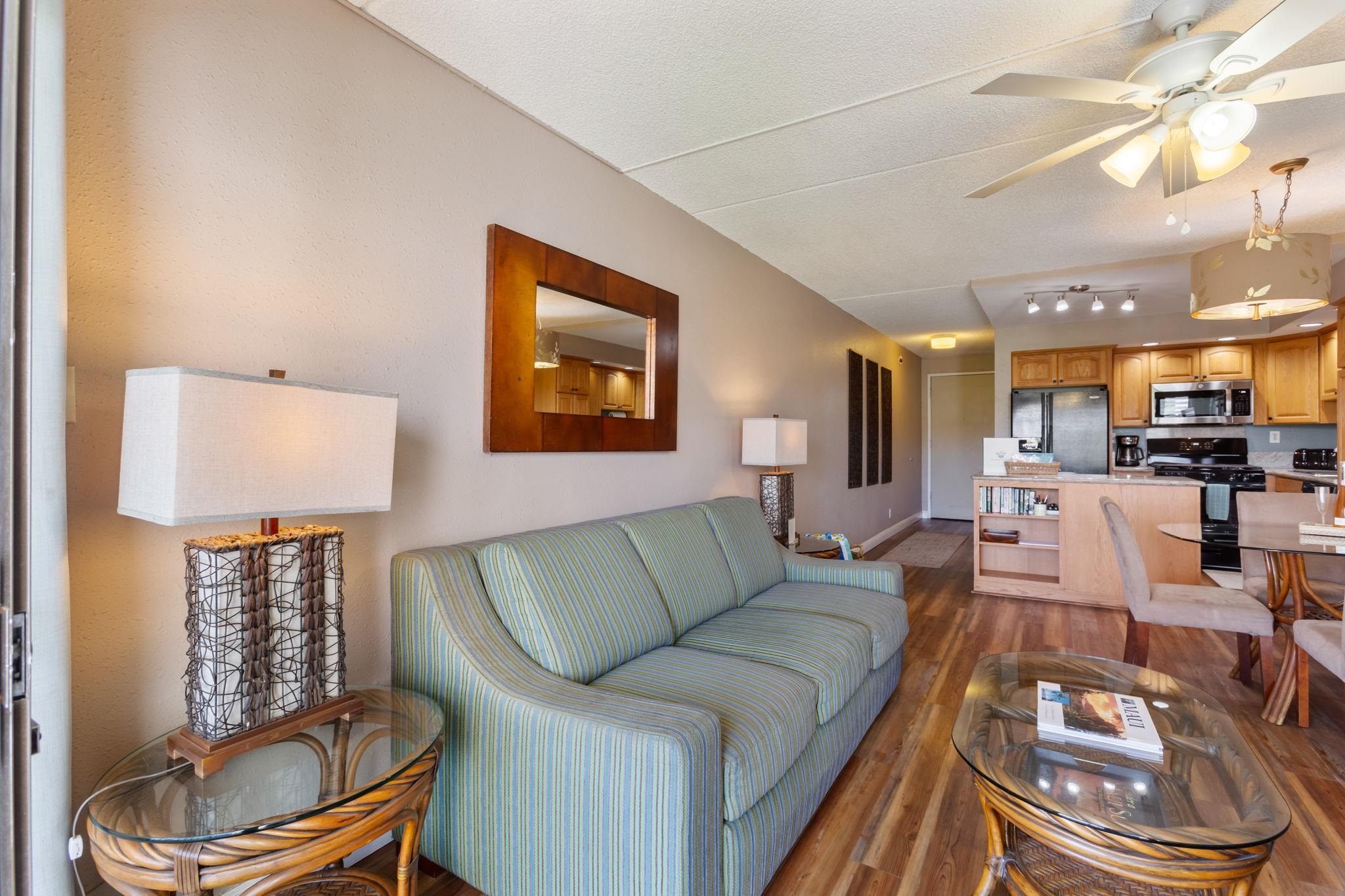 2531 South Kihei Road, Unit C414 Kihei, HI 96753 - Photo 11 of 47 a living room with furniture and a wooden floor