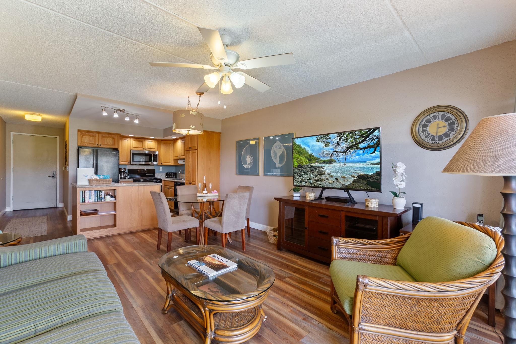 2531 South Kihei Road, Unit C414 Kihei, HI 96753 - Photo 12 of 47 a living room with furniture a window and a clock