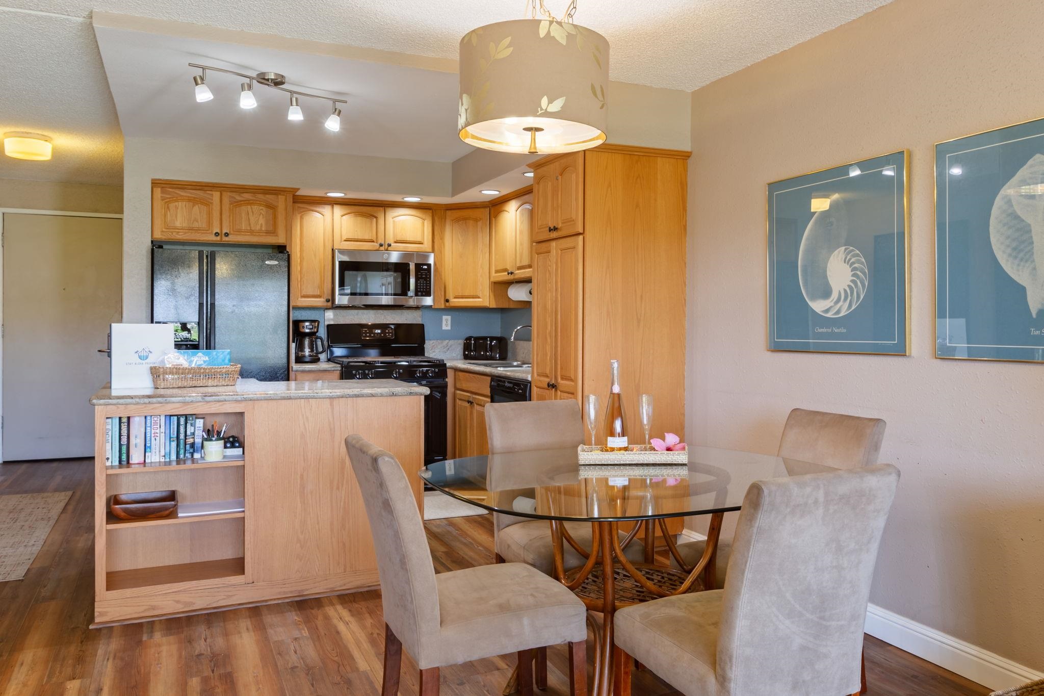 2531 South Kihei Road, Unit C414 Kihei, HI 96753 - Photo 14 of 47 a dining room with furniture and a kitchen view