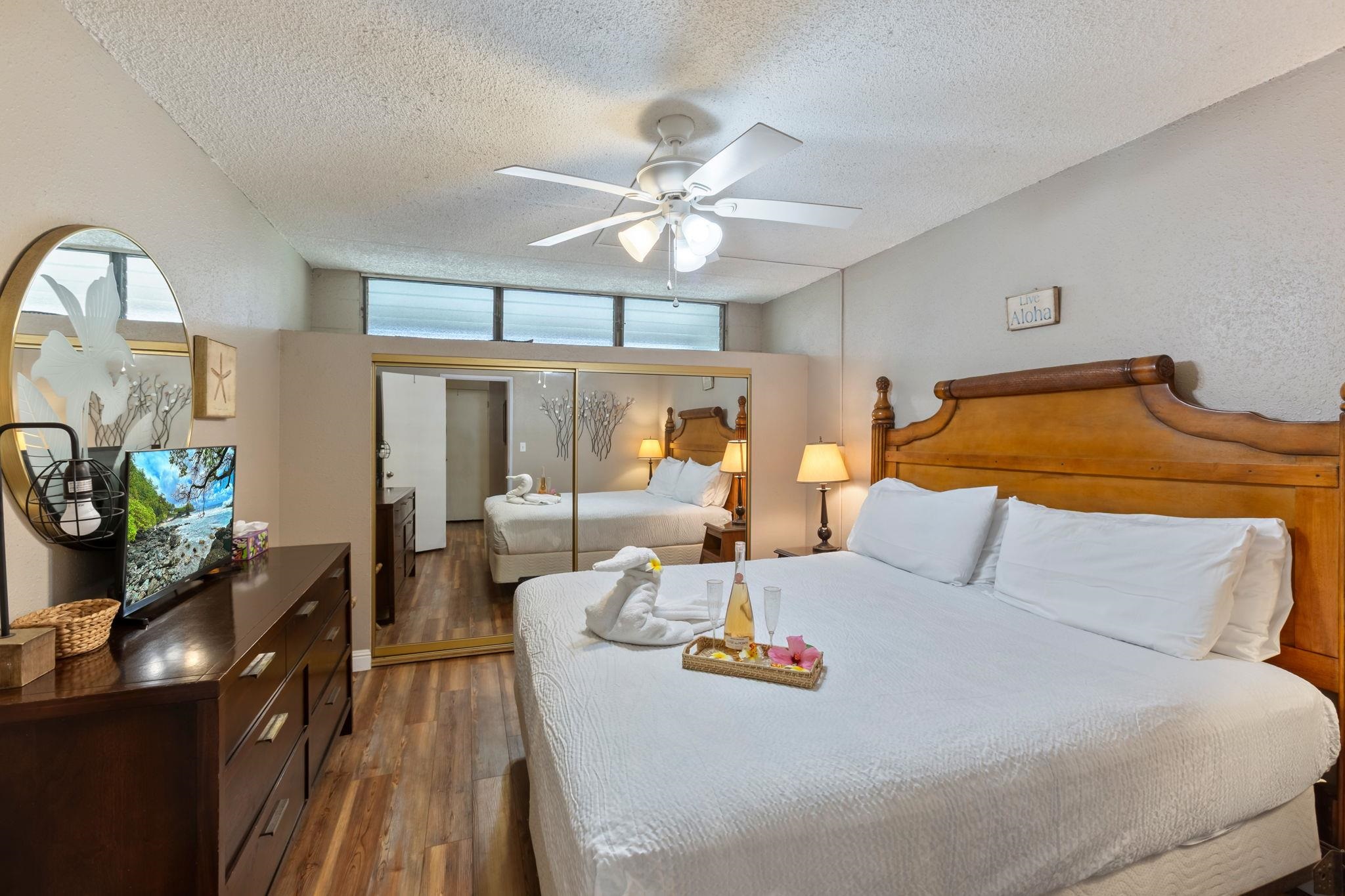 2531 South Kihei Road, Unit C414 Kihei, HI 96753 - Photo 26 of 47 a bedroom with a bed and wooden floor