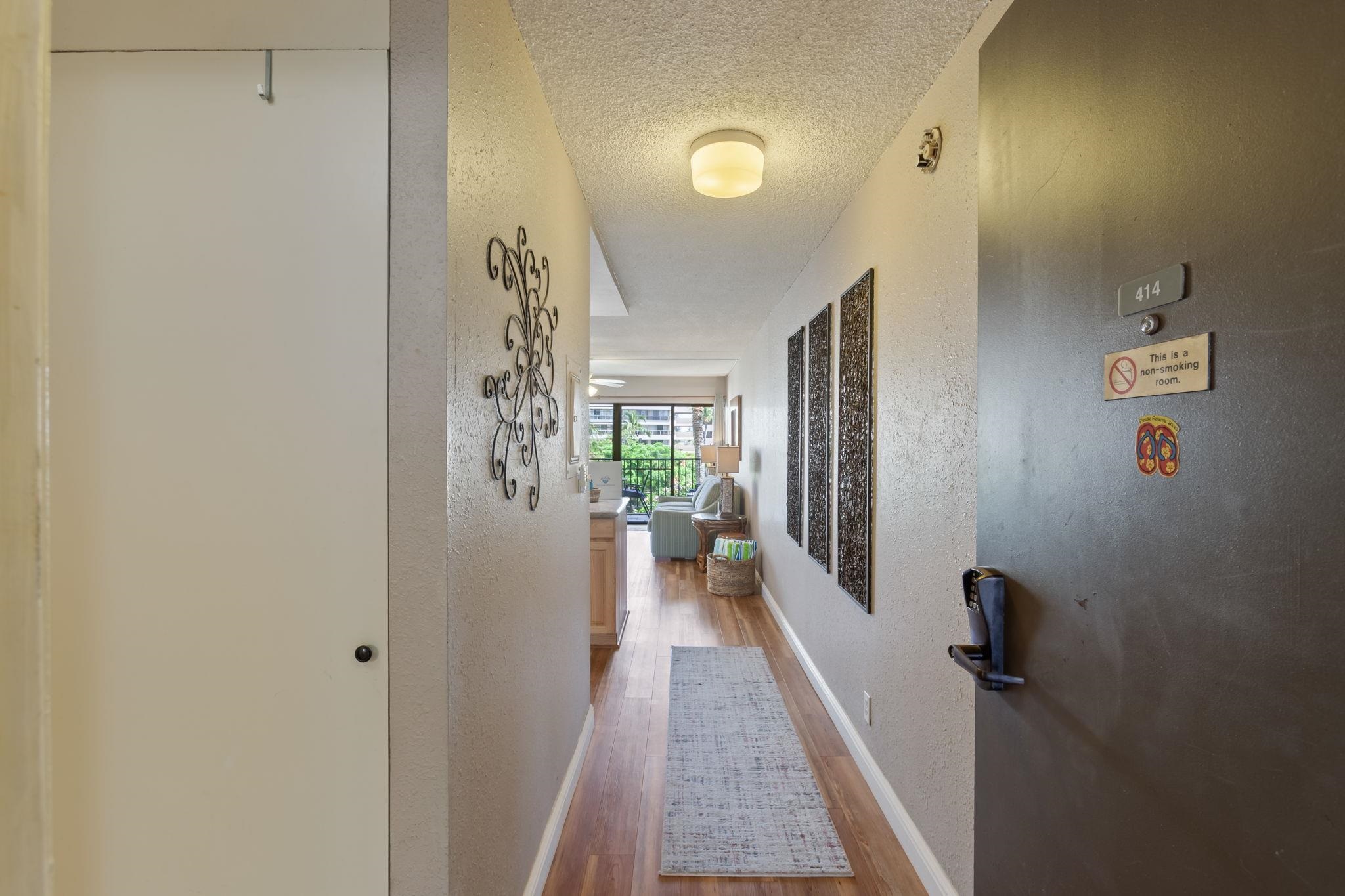 2531 South Kihei Road, Unit C414 Kihei, HI 96753 - Photo 5 of 47 a view of a hallway with wooden floor and staircase