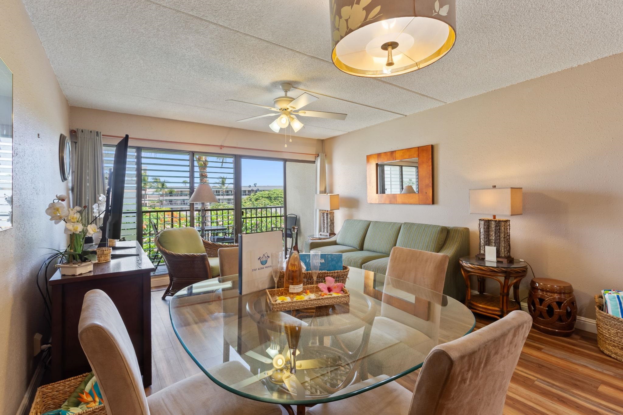 2531 South Kihei Road, Unit C414 Kihei, HI 96753 - Photo 8 of 47 a view of a dining room with furniture wooden floor and chandelier