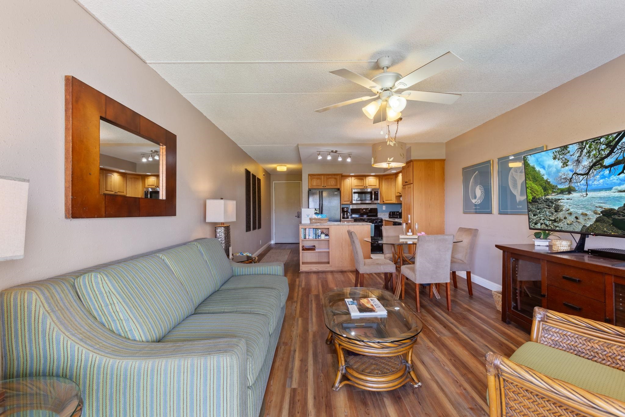 2531 South Kihei Road, Unit C414 Kihei, HI 96753 - Photo 9 of 47 a living room with furniture and a large window