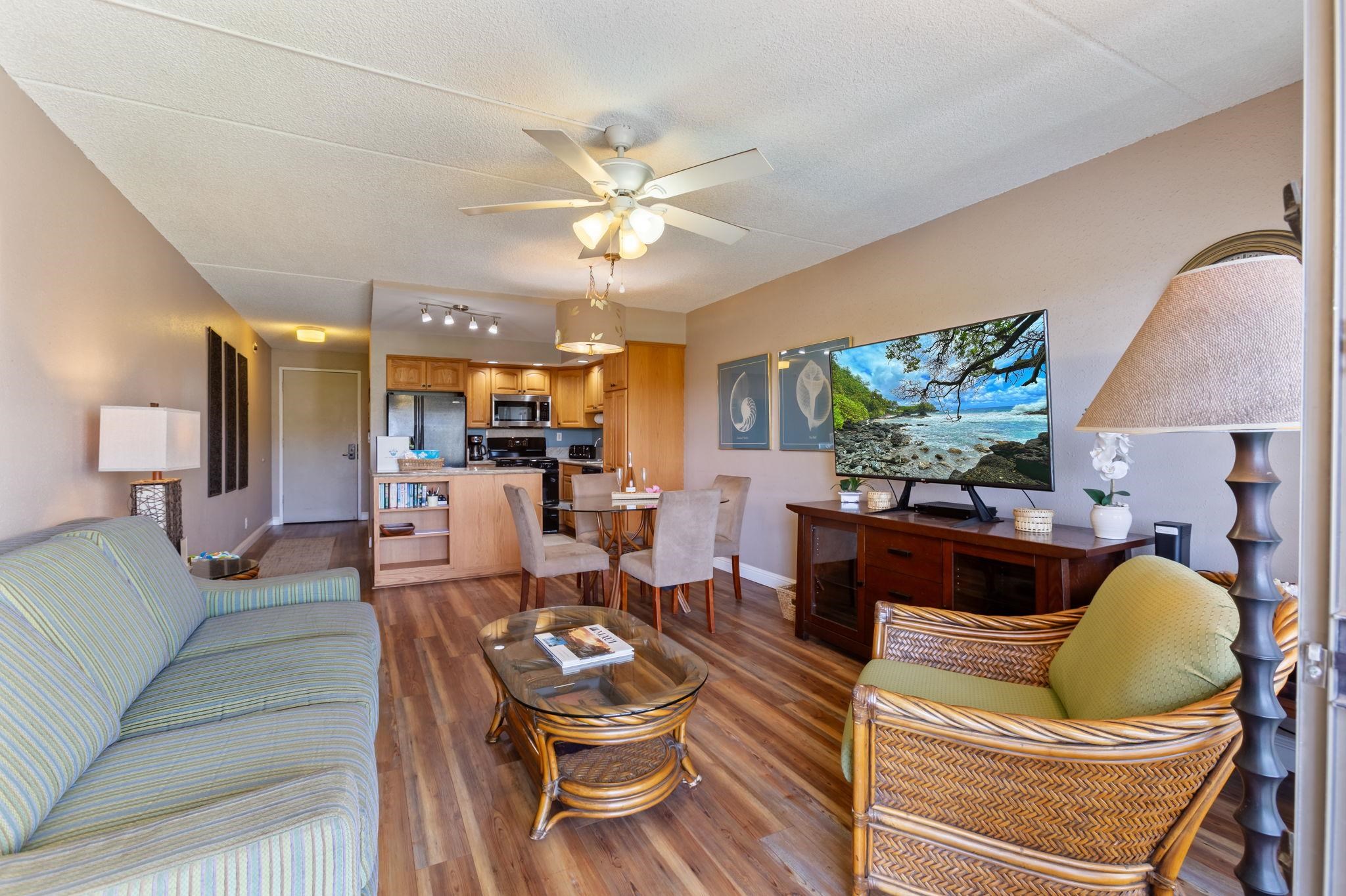 2531 South Kihei Road, Unit C414 Kihei, HI 96753 - Photo 10 of 47 a living room with furniture kitchen view and a chandelier