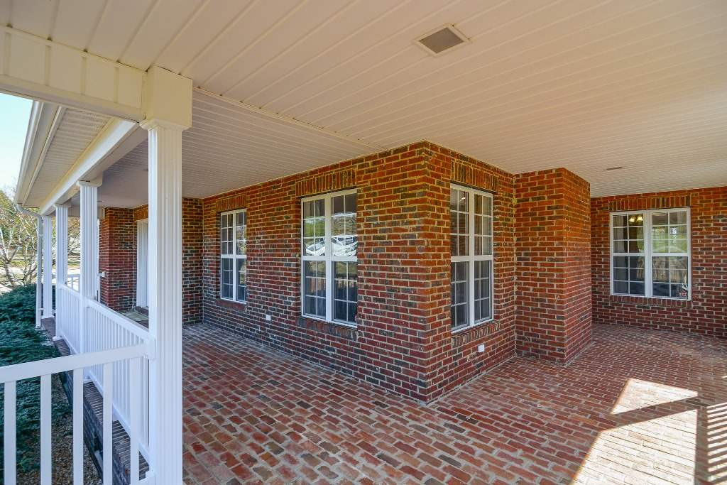 9798 Covered Bridge Road Zebulon, NC 27597 - Photo 3 of 25 Wrap front porch
