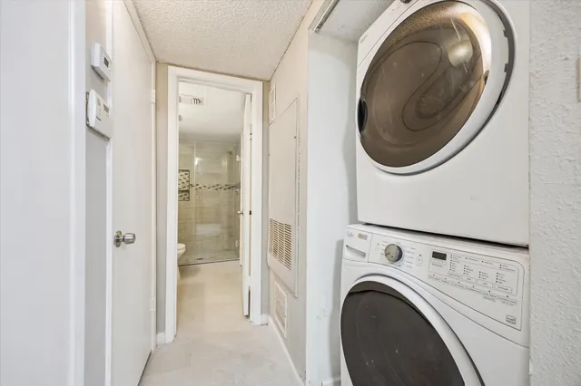 a view of a hallway with washer and dryer