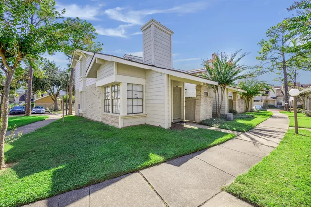 swimming pool with outdoor seating and yard in the back
