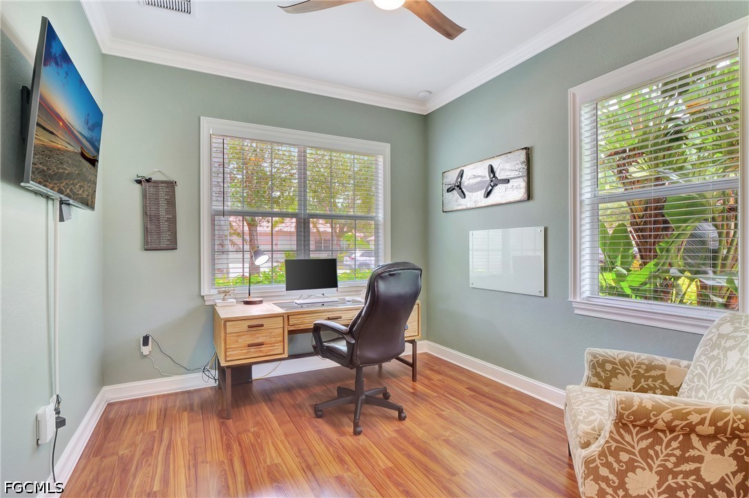 11230 Suffield Street Fort Myers, FL 33913 - Photo 5 of 42 a workspace with wooden floor and a window