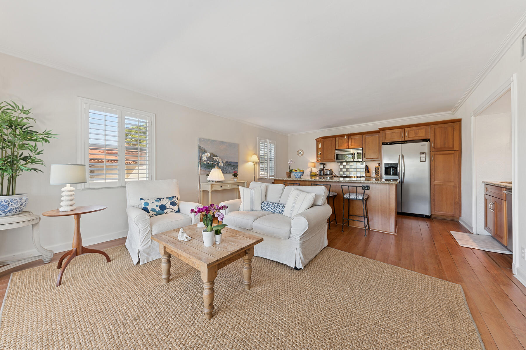 3883 Gulf Stream Road, Unit 1N Gulf Stream, FL 33483 - Photo 2 of 30 a living room with furniture and a table