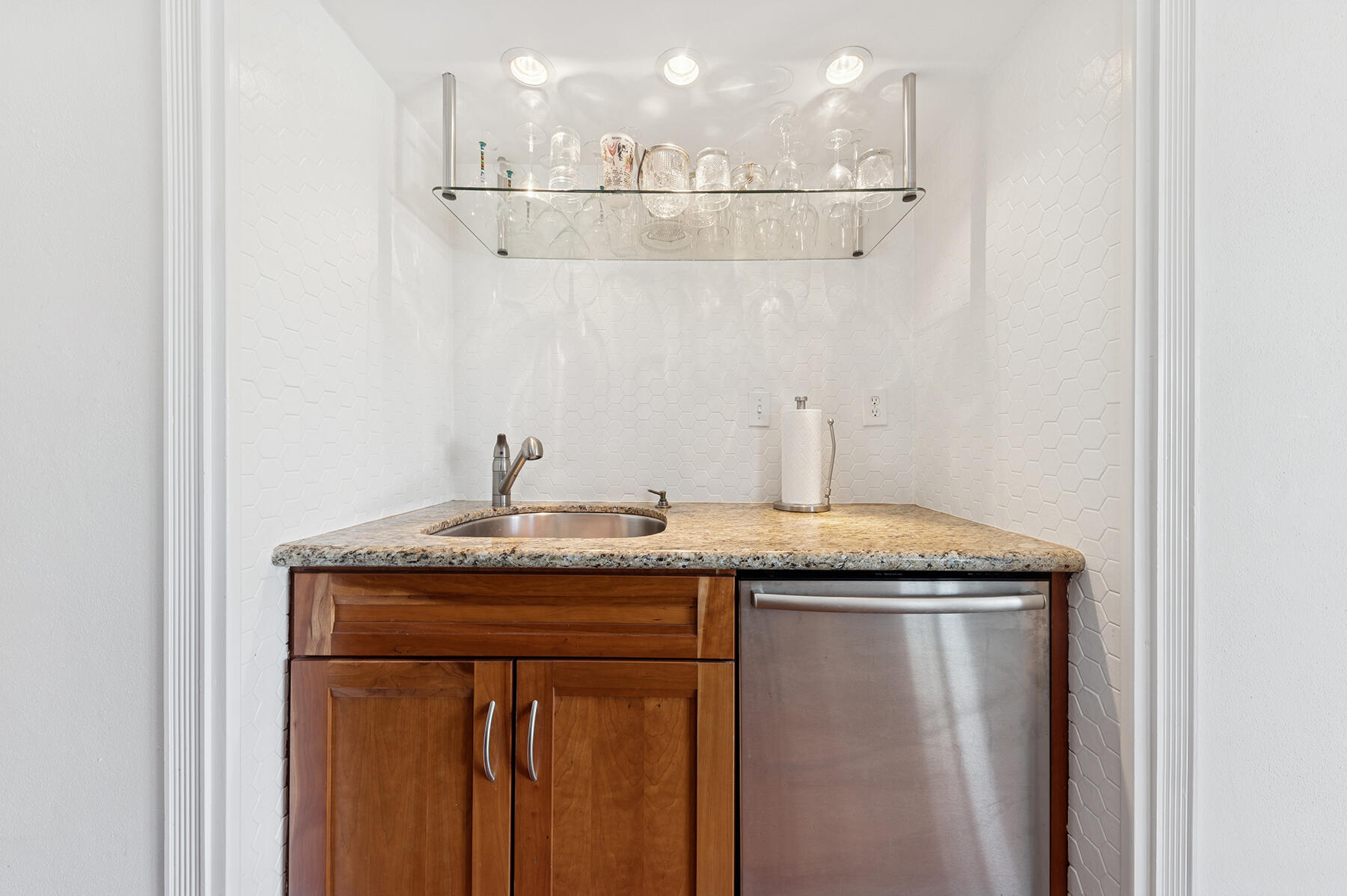 3883 Gulf Stream Road, Unit 1N Gulf Stream, FL 33483 - Photo 4 of 30 a bathroom with a granite countertop sink and a mirror