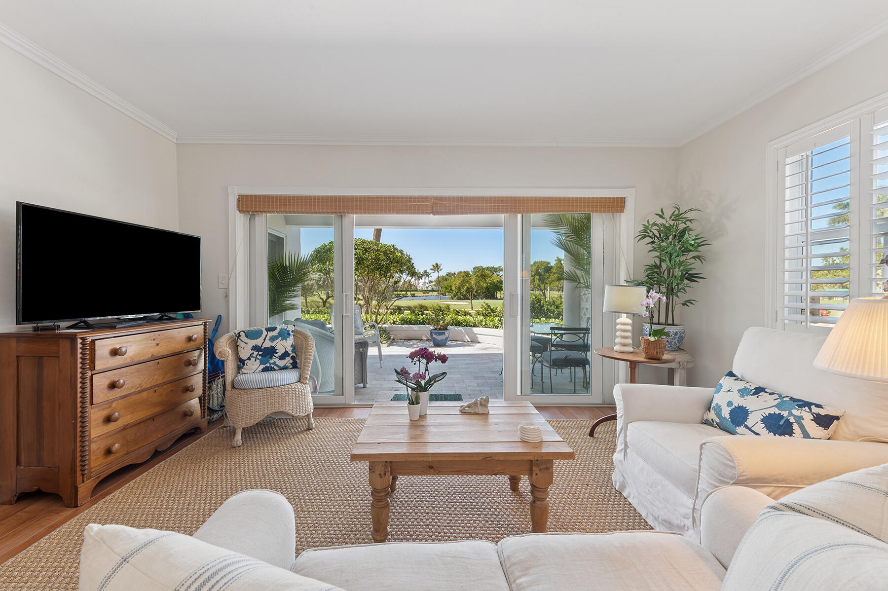 3883 Gulf Stream Road, Unit 1N Gulf Stream, FL 33483 - Photo 6 of 30 a living room with furniture and a flat screen tv