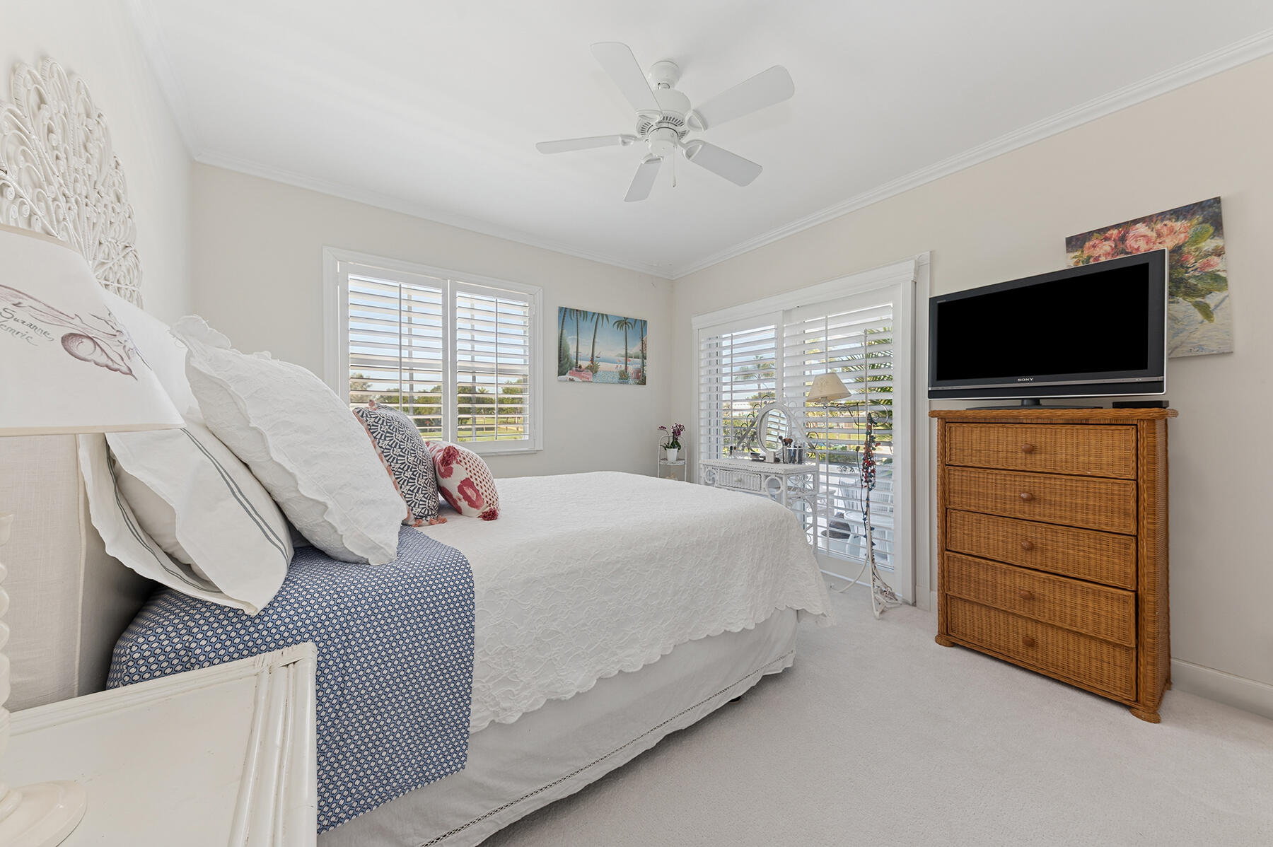 3883 Gulf Stream Road, Unit 1N Gulf Stream, FL 33483 - Photo 9 of 30 a bedroom with a bed and a flat screen tv