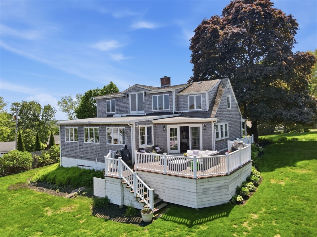 3 Talbot Road Hingham, MA 02043 - Photo 3 of 34 front view of a house with a yard table and chairs