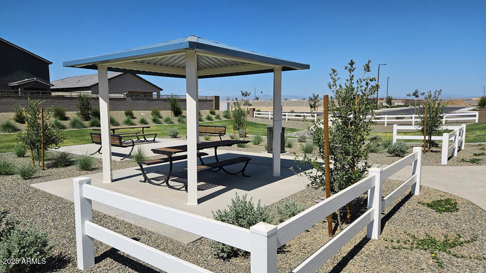 2683 Homesteaders Road San Tan Valley, AZ 85140 - Photo 14 of 21 a view of a chair and tables in the patio