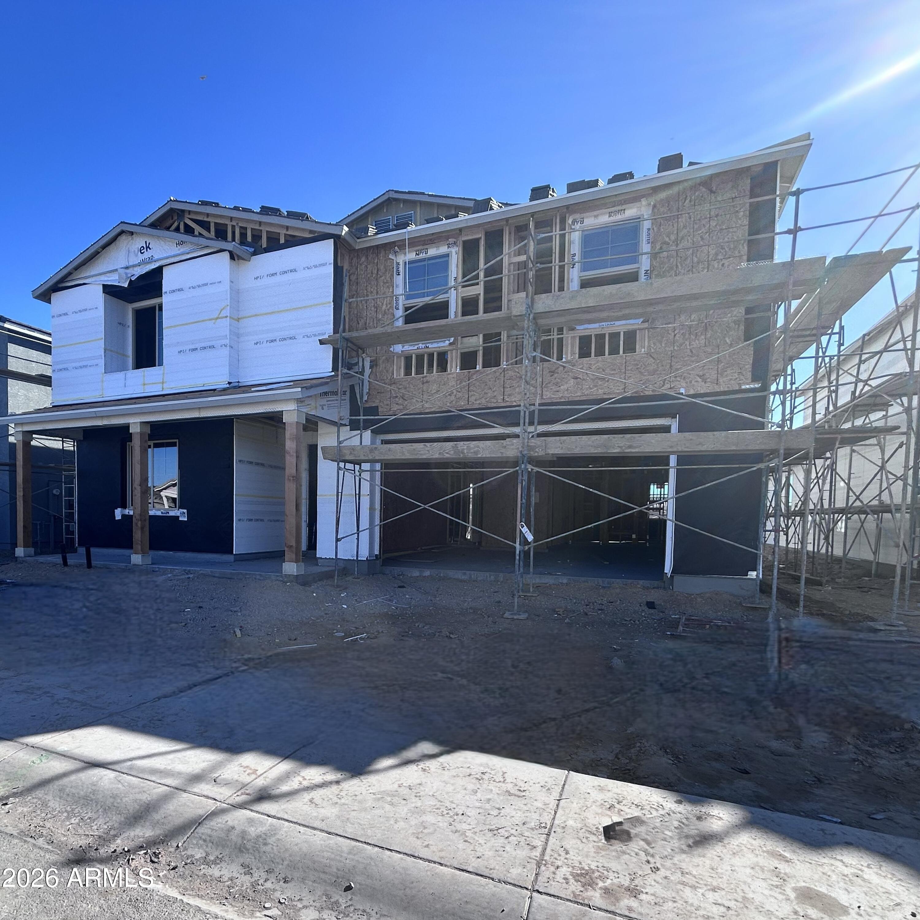 2683 Homesteaders Road San Tan Valley, AZ 85140 - Photo 2 of 21 a view of a house with a yard