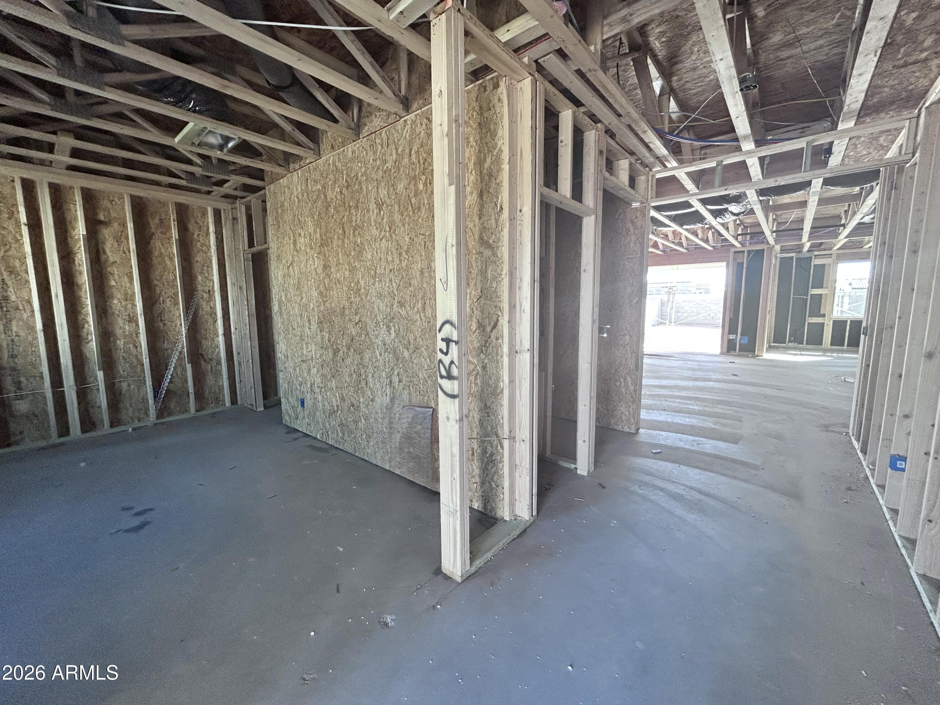 2683 Homesteaders Road San Tan Valley, AZ 85140 - Photo 3 of 21 a view of a room with wooden walls