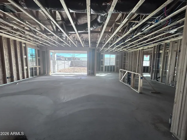 a view of an empty room with glass door