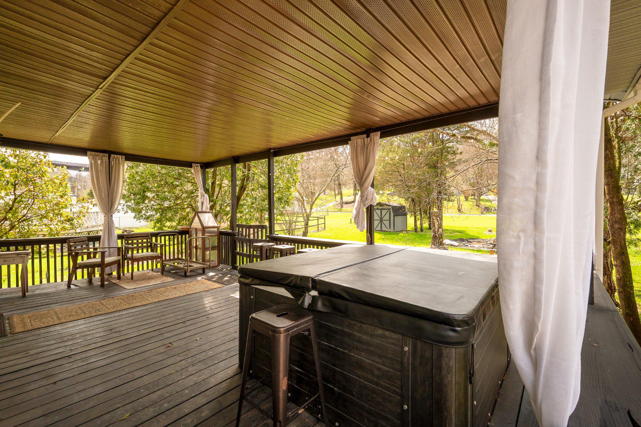 107 Walnut Street Friendsville, MD 21531 - Photo 2 of 8 Covered Porch and Hot tub
