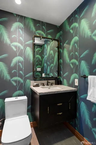 a living room with furniture a rug and a floor to ceiling window