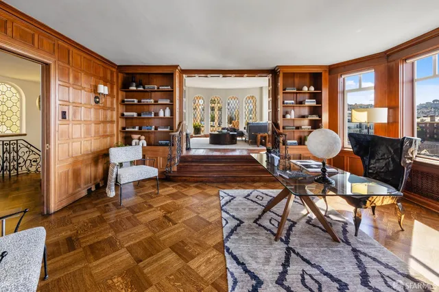 a work room with furniture and a rug