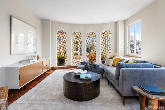 a living room with furniture and a large window