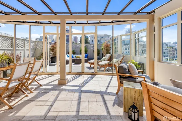 a outdoor space with a large window and furniture