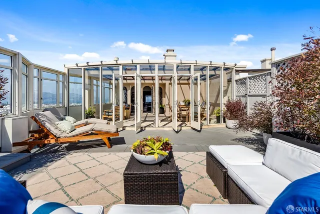 an aerial view of residential houses with city view