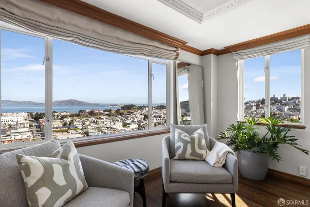 a view of a living room and a large window