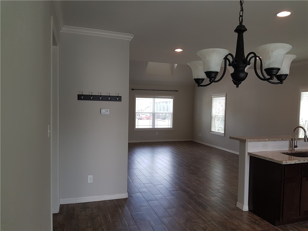 107 Ehlinger Drive Bryan, TX 77801 - Photo 6 of 50 a view of a room with wooden floor and windows