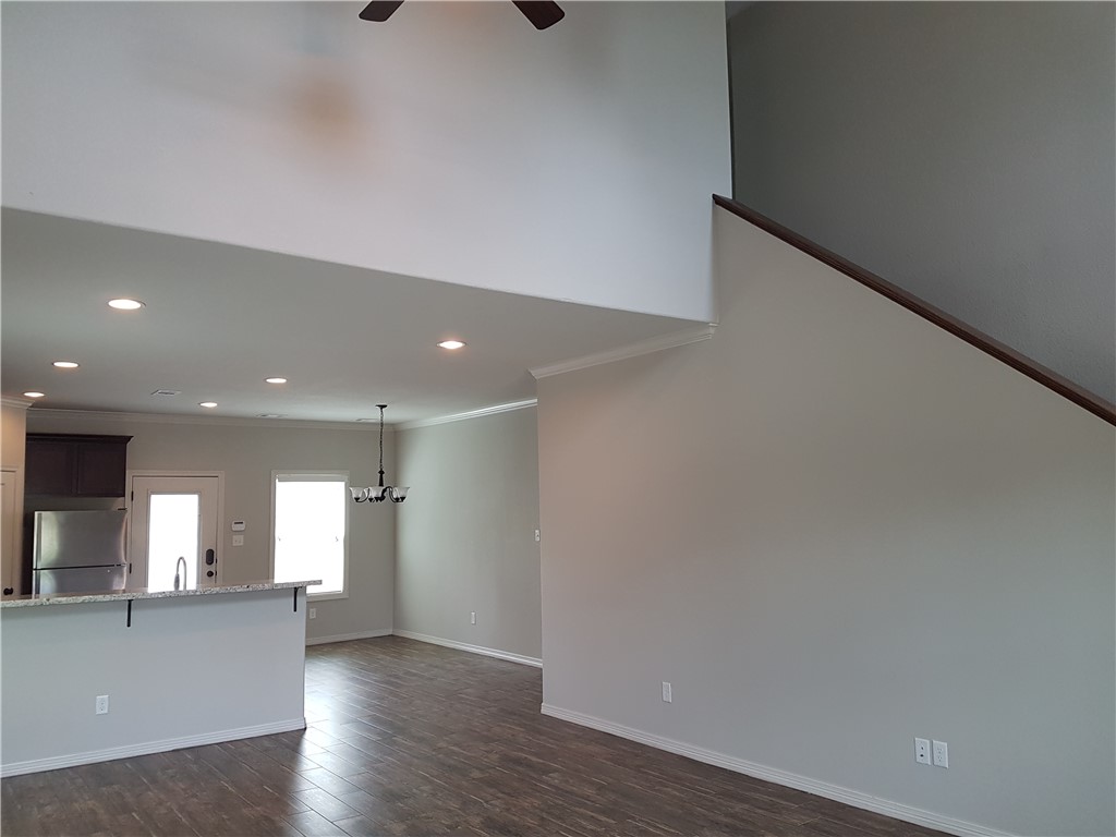 107 Ehlinger Drive Bryan, TX 77801 - Photo 10 of 50 a view of a kitchen with a sink and wooden floor