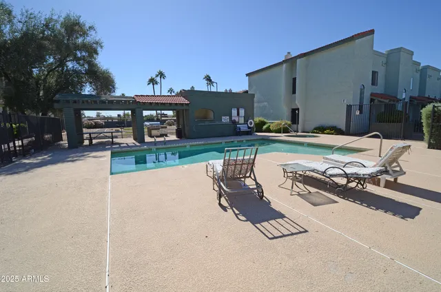 a view of a backyard with sitting area