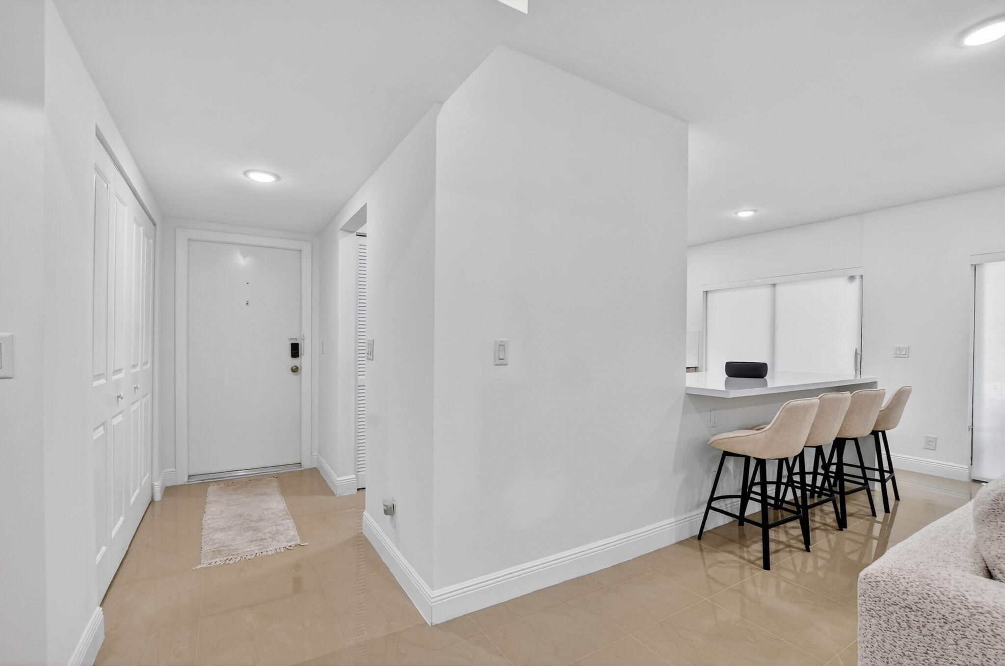 6335 Longboat Lane West, Unit E104 Boca Raton, FL 33433 - Photo 18 of 46 Hallway & Kitchen Counter