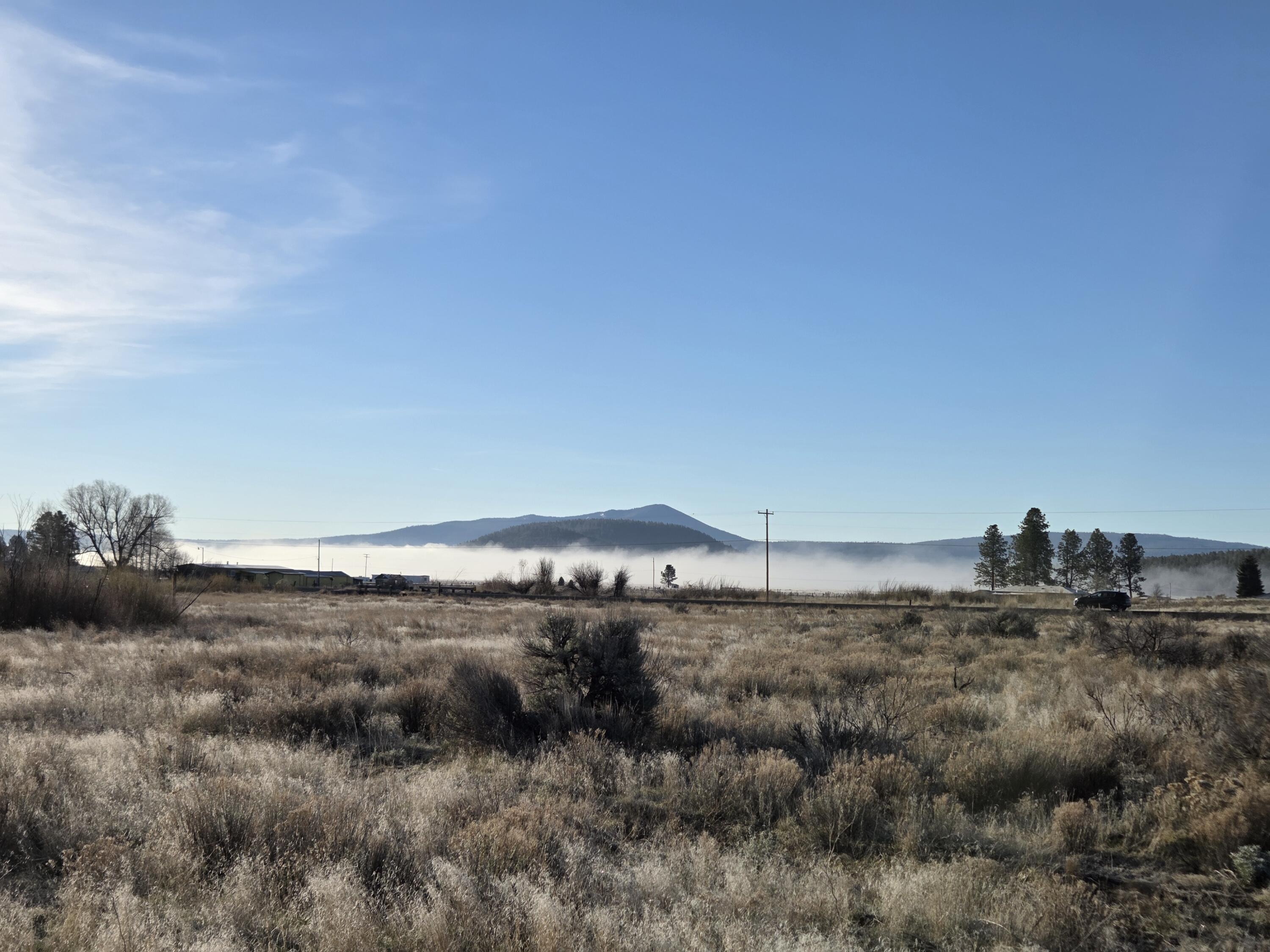 0 Drews Road, Unit LOT 8 Chiloquin, OR 97624 - Photo 26 of 39 a view of a dry field with wooden fence