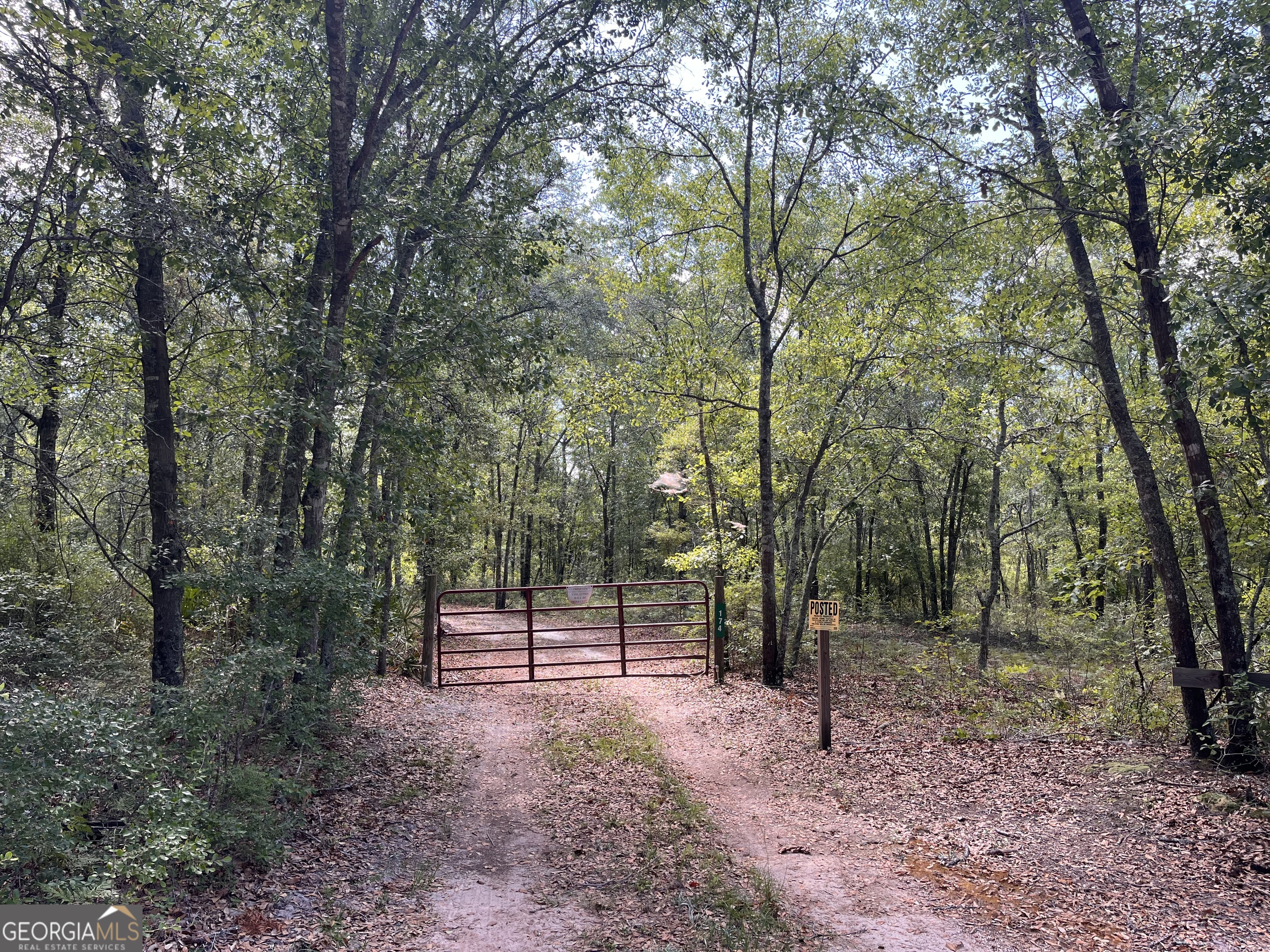 174 Old Groveland Road Pembroke, GA 31321 - Photo 1 of 1 Gate from road. Sign added in view from road.