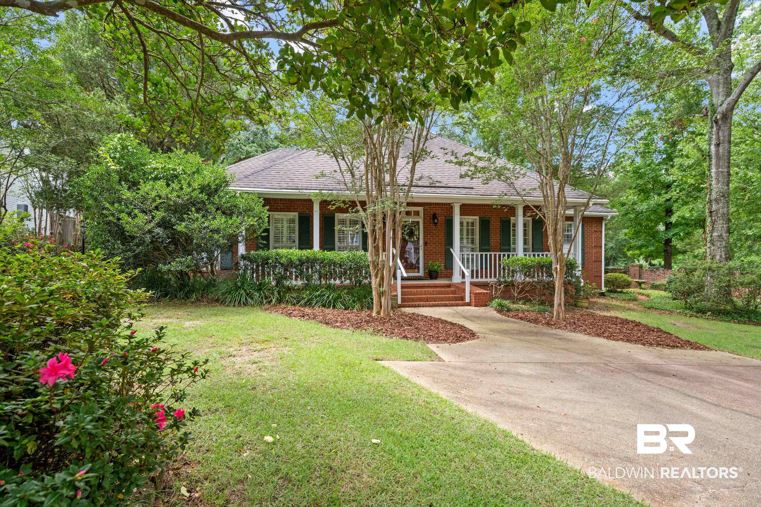 6638 Jackson Square Daphne, AL 36526 - Photo 36 of 62 Ranch-style house featuring a porch and a front lawn
