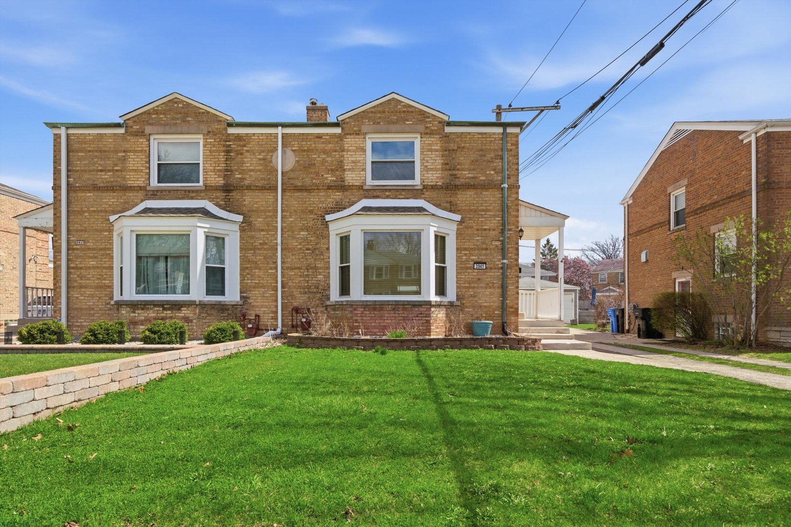 3941 North Mobile Avenue Chicago, IL 60634 - Photo 1 of 46 a front view of a house with a yard
